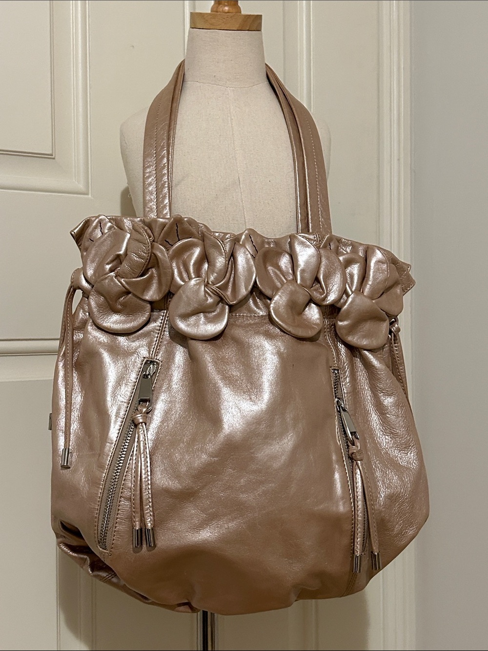 American Glamour Badgley Mischka  Metallic Blush Floral-Trim Leather Bag